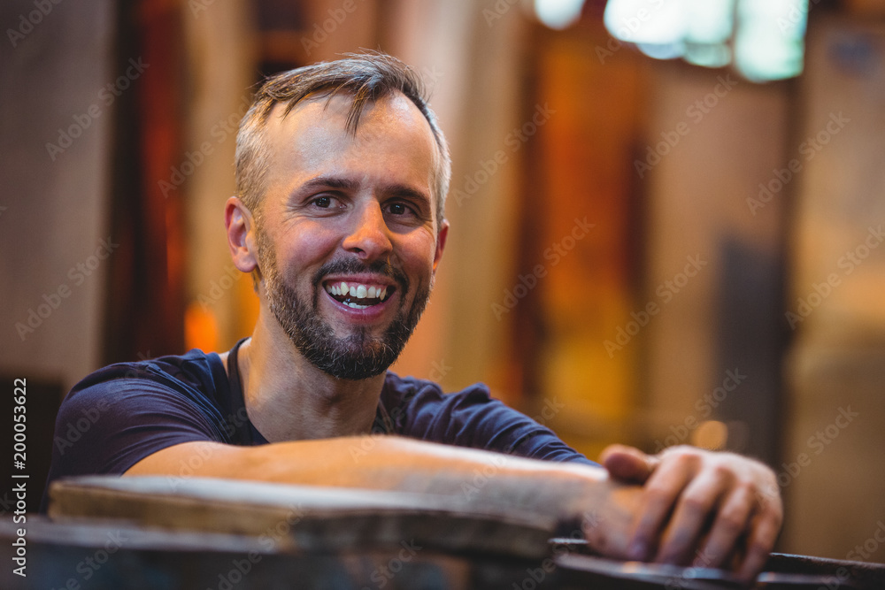 Close-up of smiling glassblower Close-up of smiling glassblower