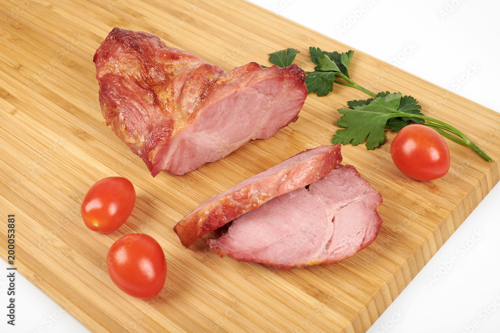 Cooked sliced pork barbecue steak on wooden cutting board on the white background Cooked sliced pork barbecue steak on wooden cutting board on the white background