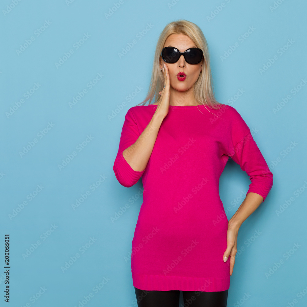 Surprised Beautiful Blond Woman Is Holding Hand On Chin Surprised Beautiful Blond Woman Is Holding Hand On Chin