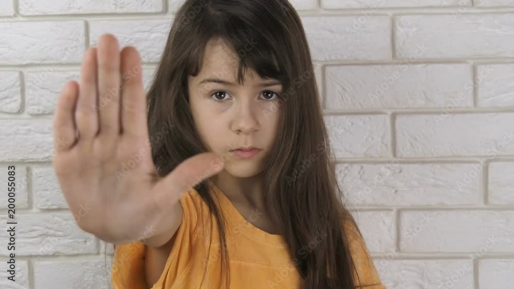 Child abuse. Domestic violence. Stop gesture. The child shows a gesture to stop. Child abuse. Domestic violence. Stop gesture. The child shows a gesture to stop.