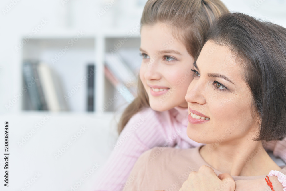 Close-up portrait of a charming girl with mom Close-up portrait of a charming girl with mom