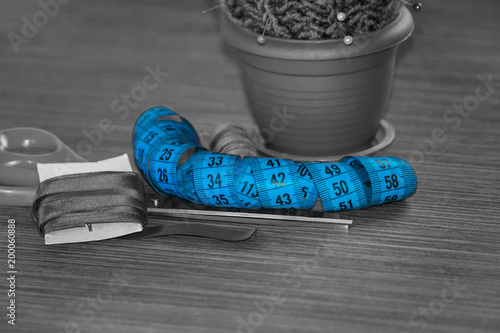 Sewing accessories on table, colored spools of thread