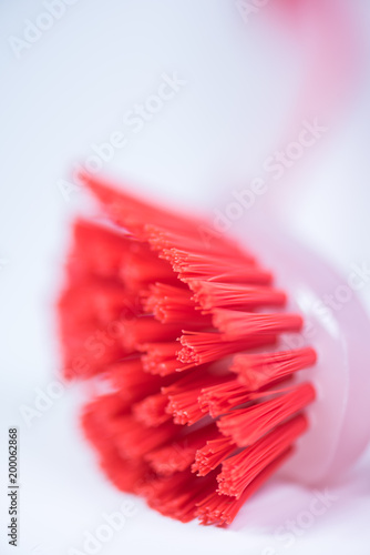 Couple of colorful kitchen cleaning equipment over white background