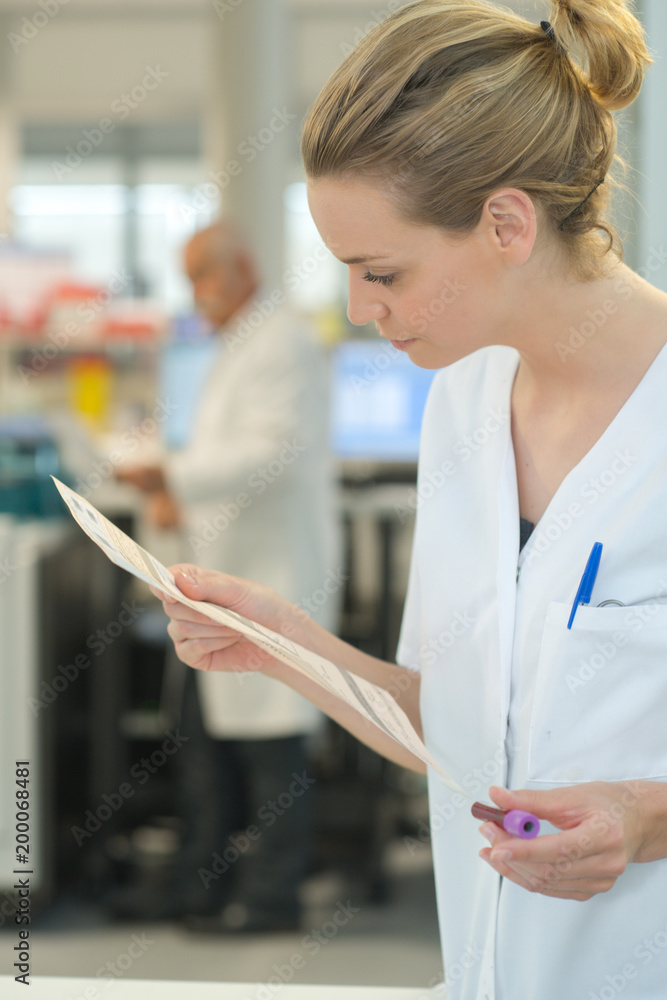 female doctor reading a document