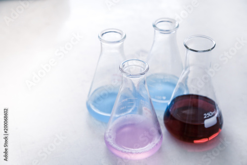 Wallpaper Mural Group of glassware scientific equipment in chemical laboratory, that is a erlenmeyer flask with chemicals. Torontodigital.ca
