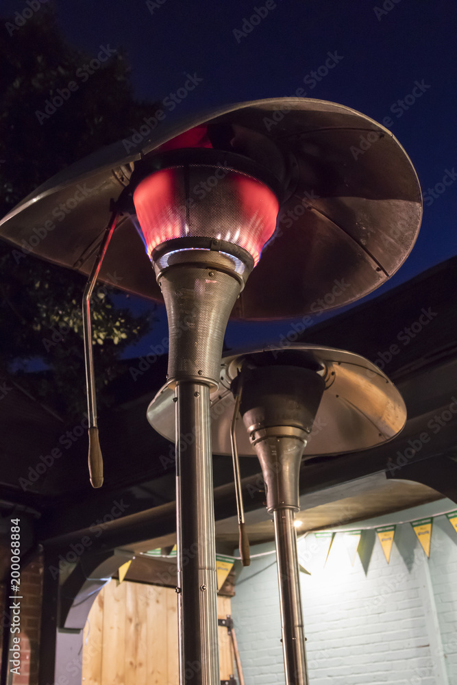 Outdoor gas patio heater at night