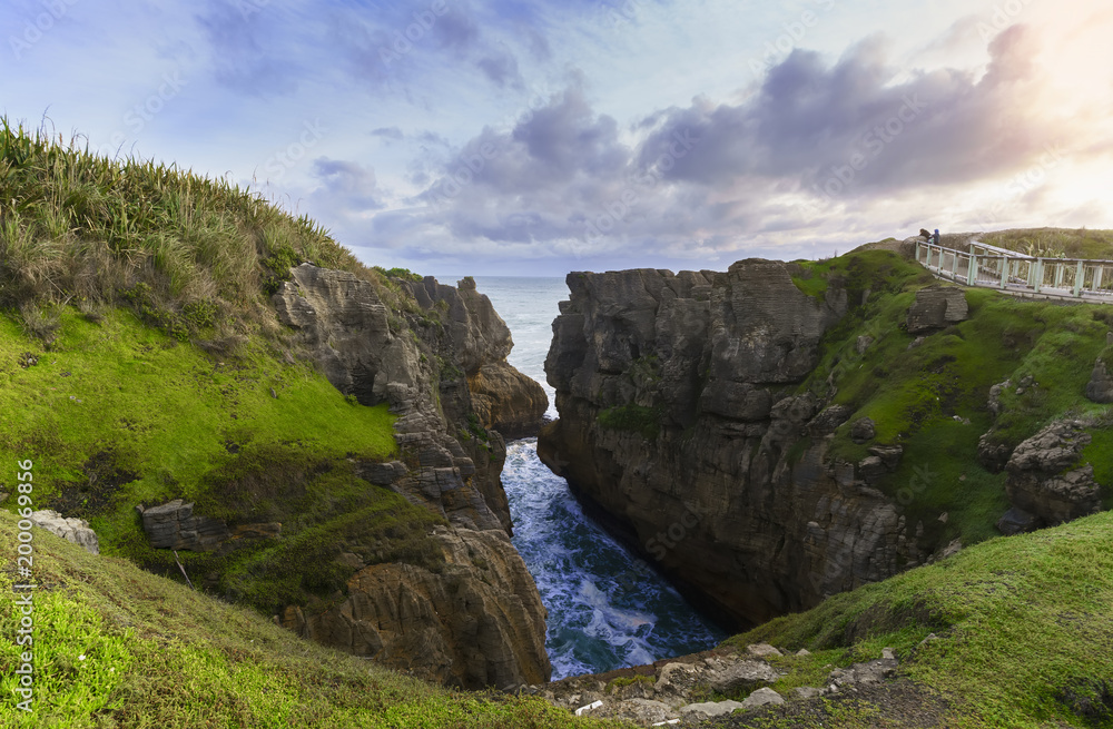 Beautiful Pancake Rocks and Blowholes in sunset , located in Paparoa National Park , Punakaiki , South Island of New Zealand Beautiful Pancake Rocks and Blowholes in sunset , located in Paparoa National Park , Punakaiki , South Island of New Zealand