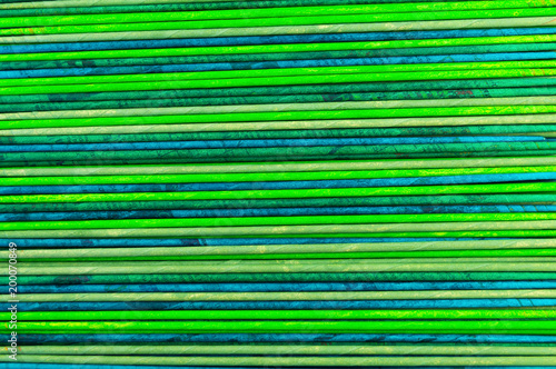 Texture from horizontally arranged tubes, twisted from newsprint, colors - turquoise, wormwood, green, light green