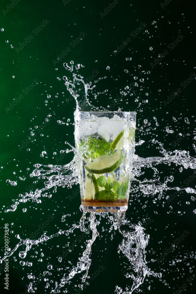 fresh mojito drink with liquid splash and crushed ice in freeze motion. fresh mojito drink with liquid splash and crushed ice in freeze motion.