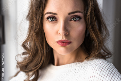 portrait of beautiful brunette woman looking at camera
