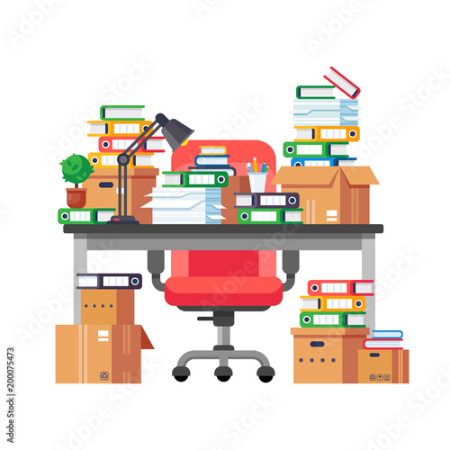 Office workplace with pile of paper documents and file folders.