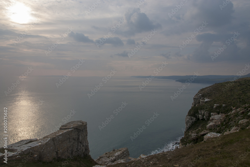 Evening spring sunset over Jurassic Coast from St Albans or Adhelms Head, Purbeck, Dorset, UK