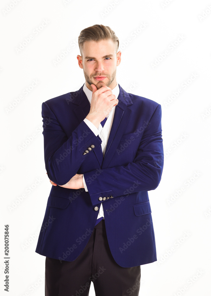 Man with unshaven and thoughtful face holds hand at chin. Man with unshaven and thoughtful face holds hand at chin.