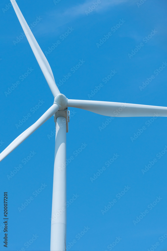 Wind turbines generating electricity with blue sky