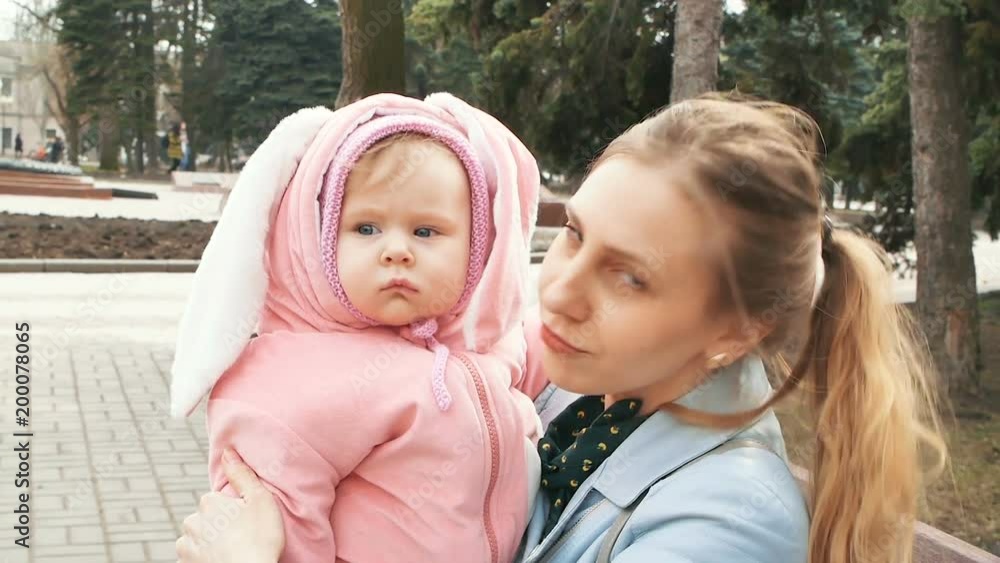 mother with child walking in Park in spring mother with child walking in Park in spring