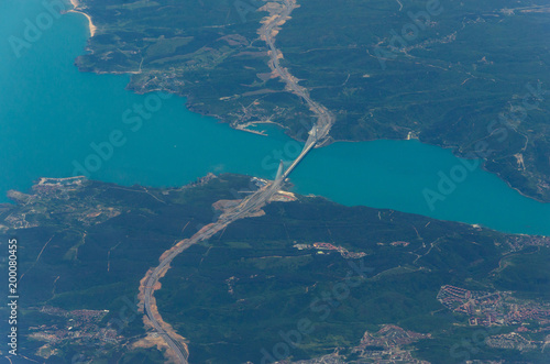 Aerial shooting from an airplane flying over the ground Turkey Istanbul Sultan Selim Yavuz Bridge