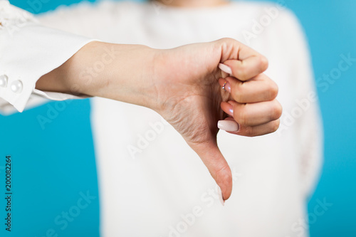 Female hand on blue background