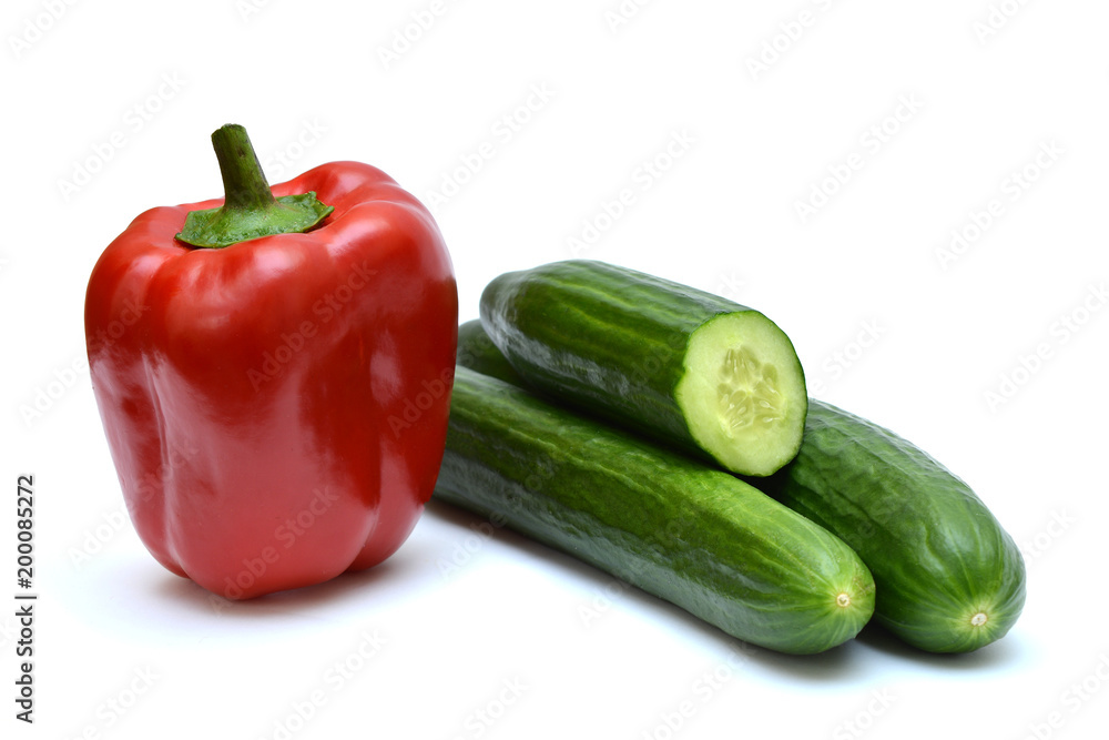 Red peppers and cucumbers on white background Red peppers and cucumbers on white background