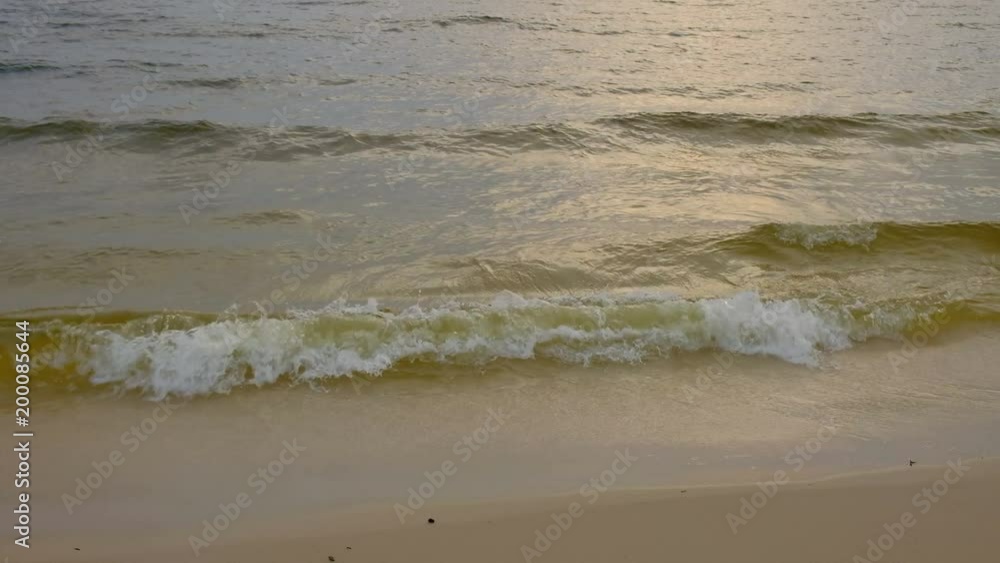 Waves on the beach. Morning at sea, sunrise on the sea beach
Waves on the beach. Morning at sea, sunrise on the sea beach