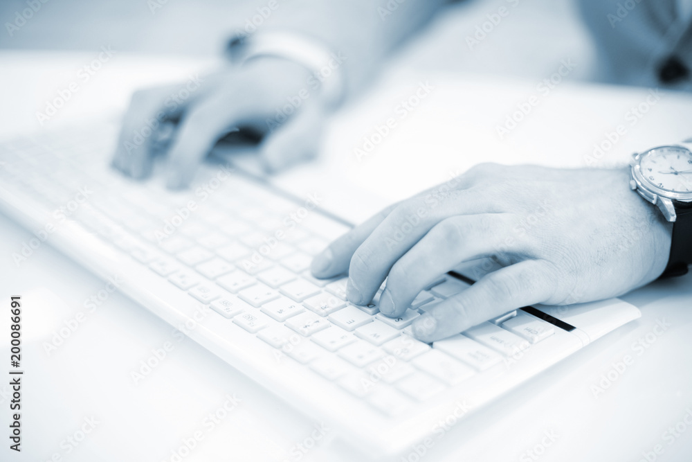 Image of man's hands typing. Selective focus. Image of man's hands typing. Selective focus.