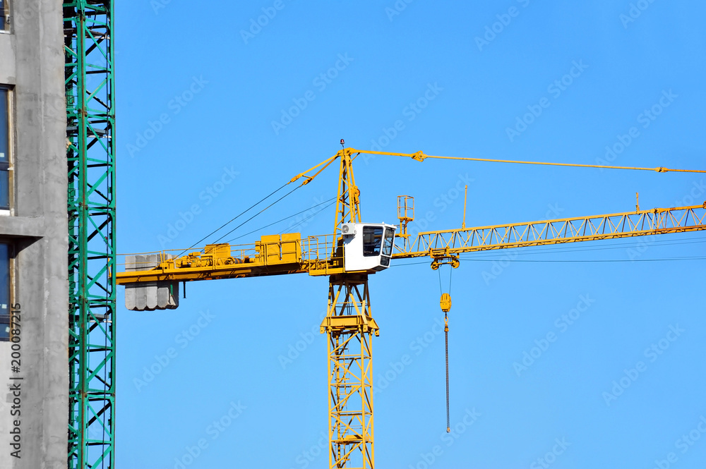 Crane and highrise construction site Crane and highrise construction site