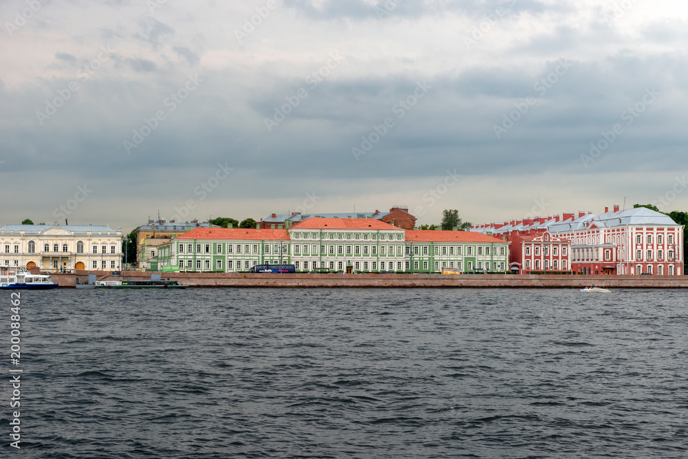 RUSSIA, SAINT PETERSBURG - AUGUST 18, 2017: View of the University Embankment, 11 - Palace of the Emperor Peter II and the Neva River