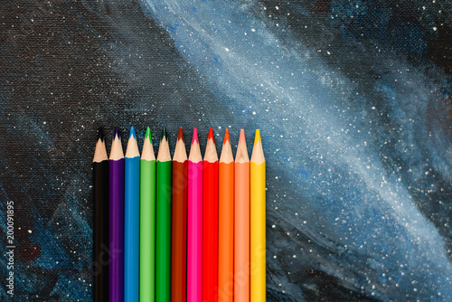 Still life developing accessories for children's creativity and hobbies of adults, colored pencils