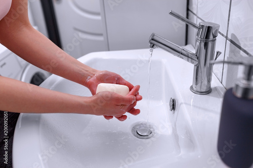 Cleaning hands. Soap in hands for cleaning. Hand hygiene..