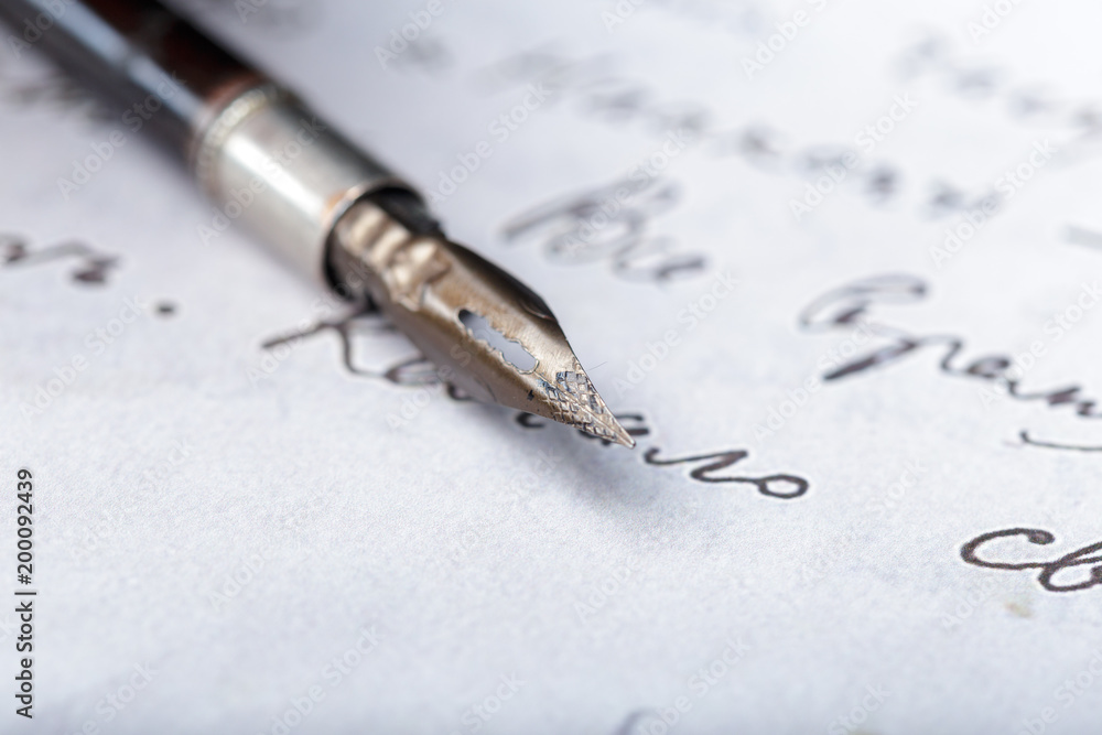 Fototapeta premium Fountain pen on an antique handwritten letter