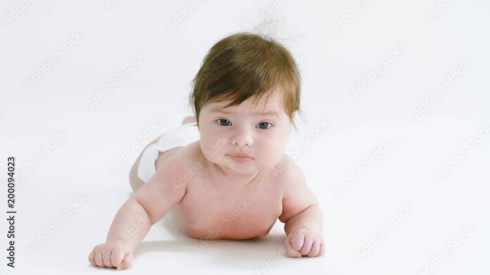 Baby lying on front at studio shot 