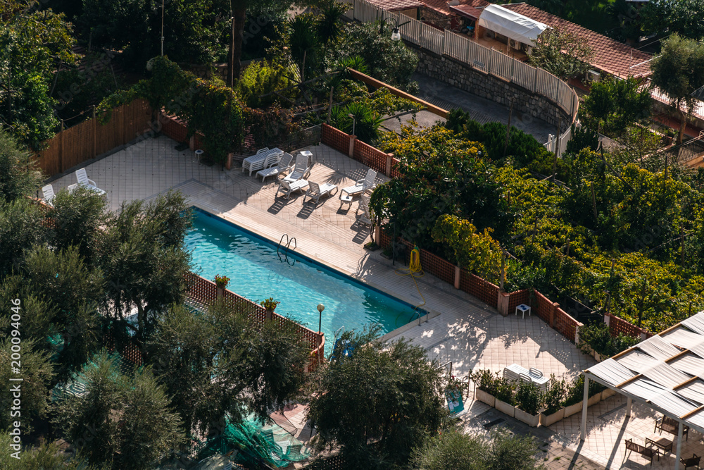 aerial view of small rectangle swimming pool in olive trees, Italy, travel vacation concept