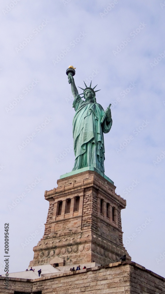 Statue of Liberty in New York in front of blue sky, Manhattan, New York City, famous lady