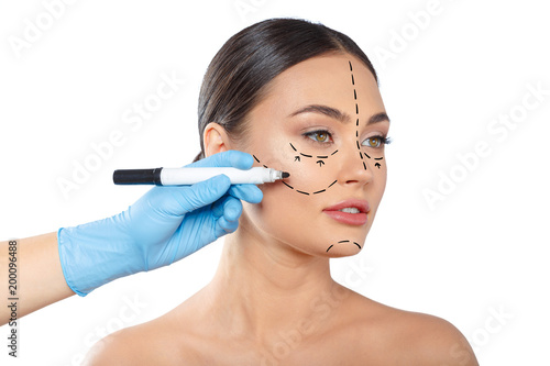 woman with dotted lines on face, cosmetology