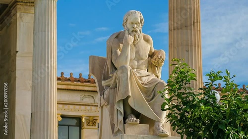 Statue of the great Greek philosopher Socrates on a marble chair, background of columns and sky, time lapse.
