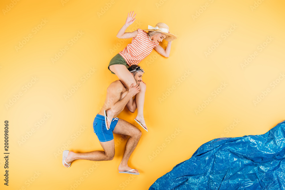happy young couple having fun together on imagine beach, summer vacation concept
