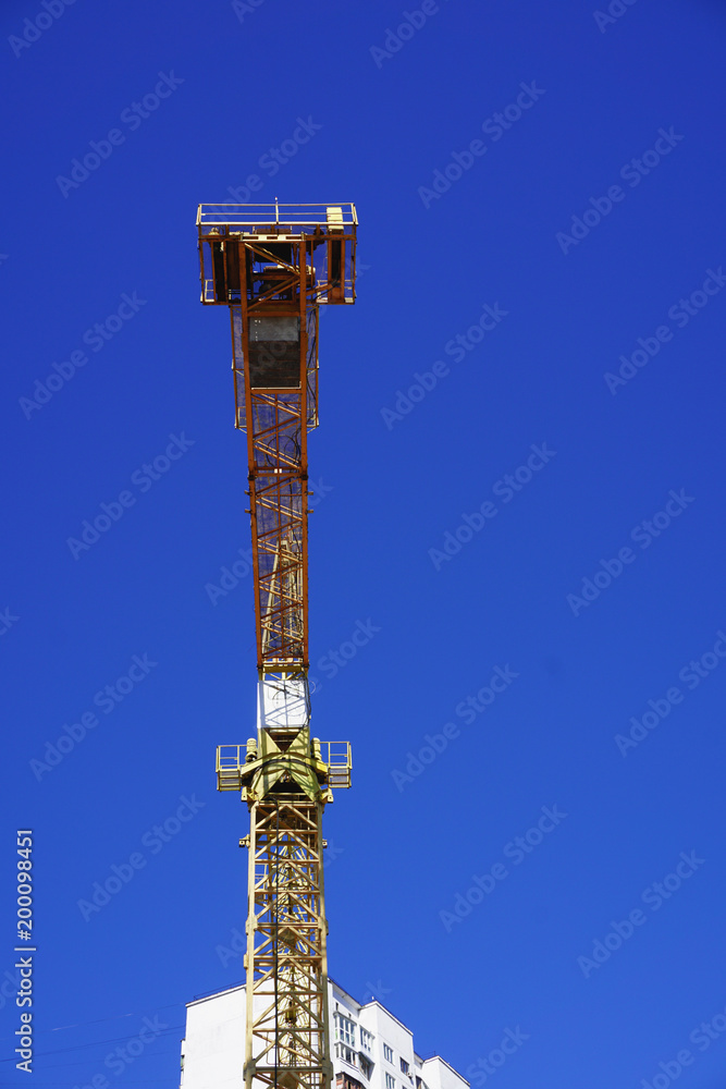 Obraz premium Yellow construction crane isolated 