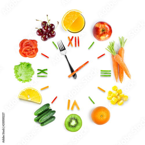 Food clock with fresh fruits and vegetables