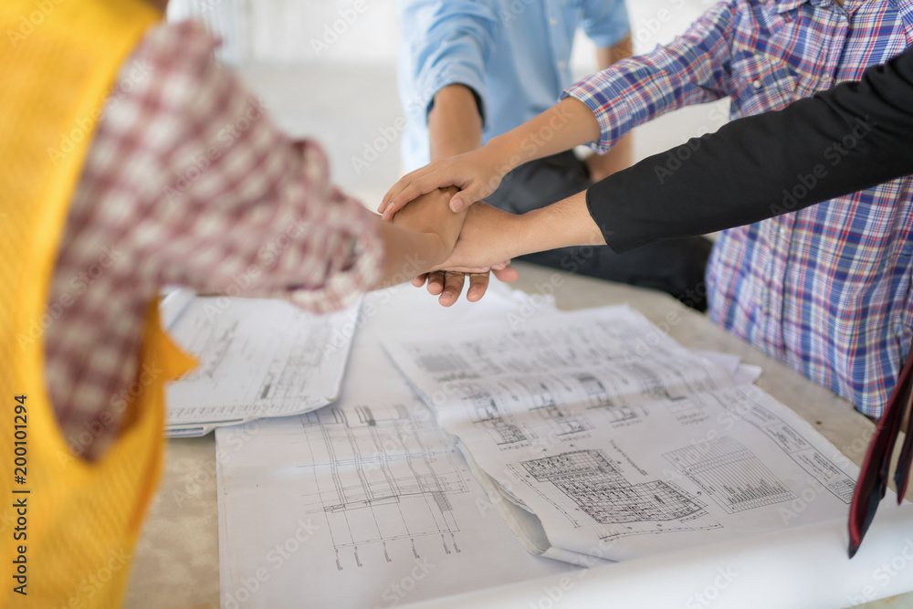 Stack hands of business engineer teamwork join together. Business partners clap them hand after complete a deal. Stack hands of business engineer teamwork join together. Business partners clap them hand after complete a deal.