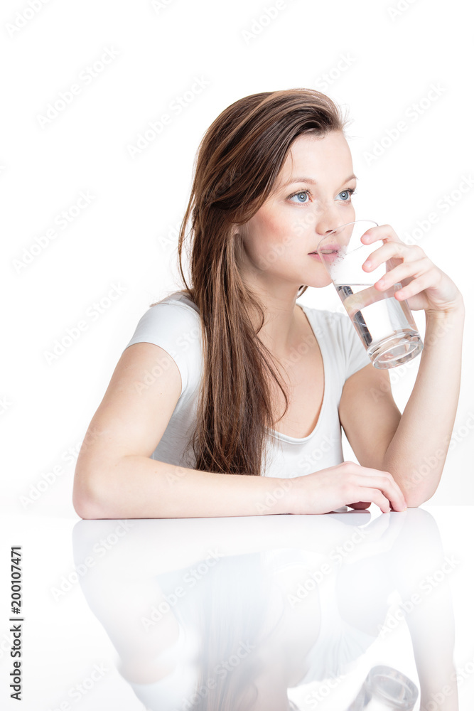 Closeup portrait of a young attractive woman drinking water from glass. Closeup portrait of a young attractive woman drinking water from glass.