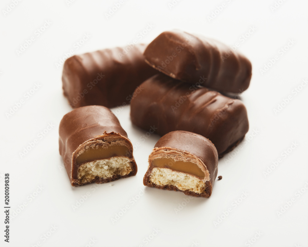 Small chocolate candies isolated on white Small chocolate candies isolated on white