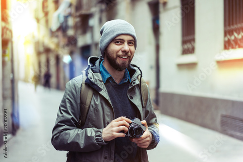 Male tourist with retro camera