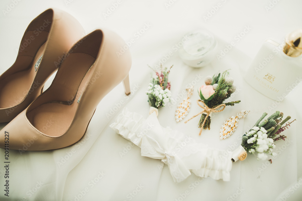 White stylish wedding shoes for bride. Close-up White stylish wedding shoes for bride. Close-up