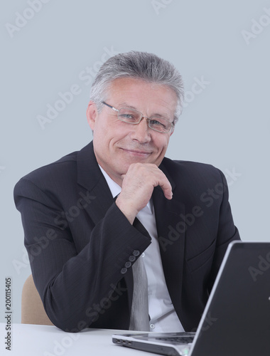 Portrait of a mature gray-haired  business man isolated on white