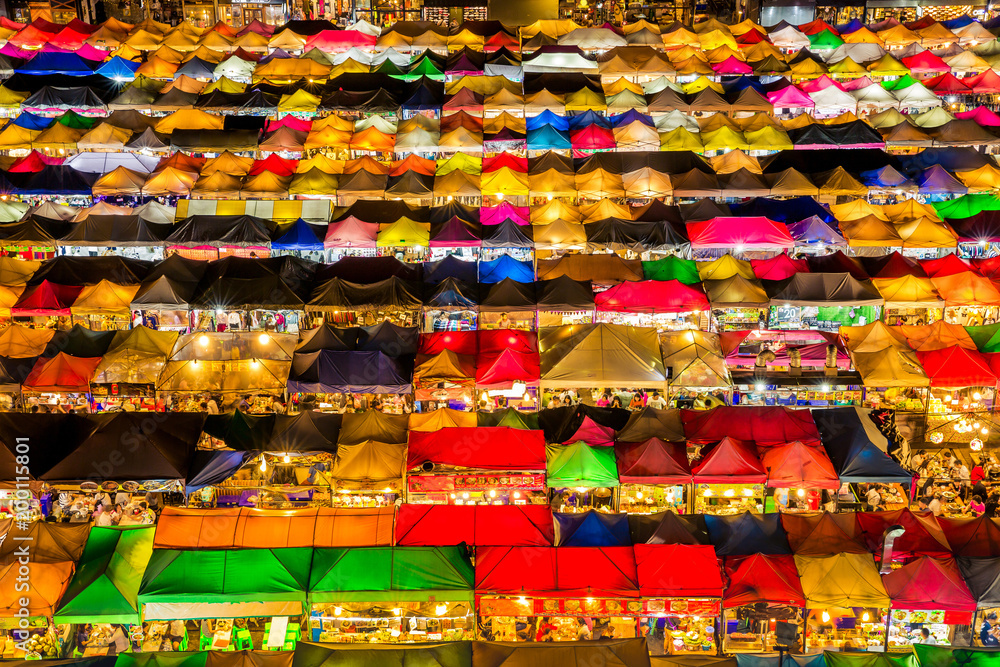 Many tent is colorful at night, abstract background. street food night market.