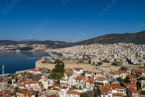Aerial view the city of Kavala in northern Greek, ancient aqueduct Kamares, homes and medieval city wall © ververidis