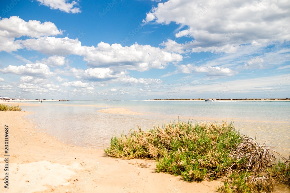 Sunny view of the local beach in Fuseta, Ria Formosa Natural park, Portugal