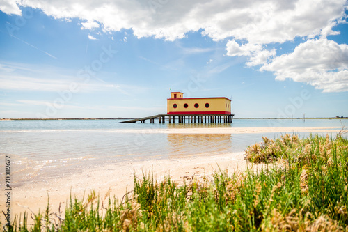 Fotografija Sunny beach view of the historical life-guard building in Fuseta, Ria Formosa Na