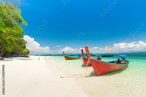 White sand beach and Long-tail boat at Khang Khao Island (Bat island), The beautiful sea Ranong Province, Thailand.