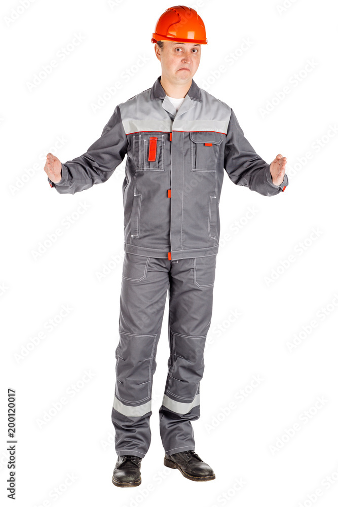 Full length portrait of a male builder over white wall background. repair, construction, building, people and maintenance concept. Full length portrait of a male builder over white wall background. repair, construction, building, people and maintenance concept.