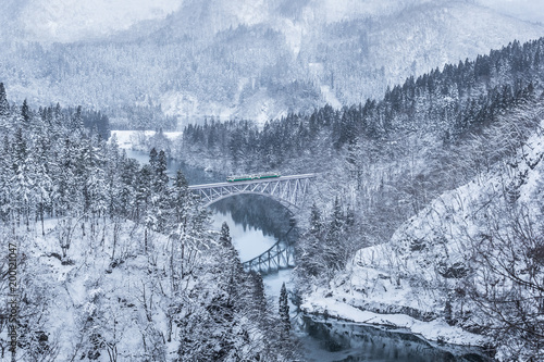 Tadami railway line and Tadami River in winter season at Fukushima prefecture. photo